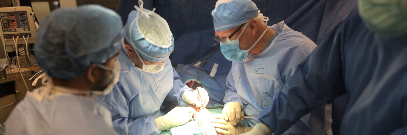 Dr-Rod-French-performing-hand-surgery-with-team